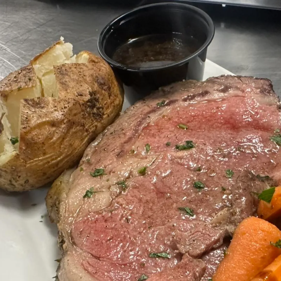 Angus prime rib with jus and baked potato