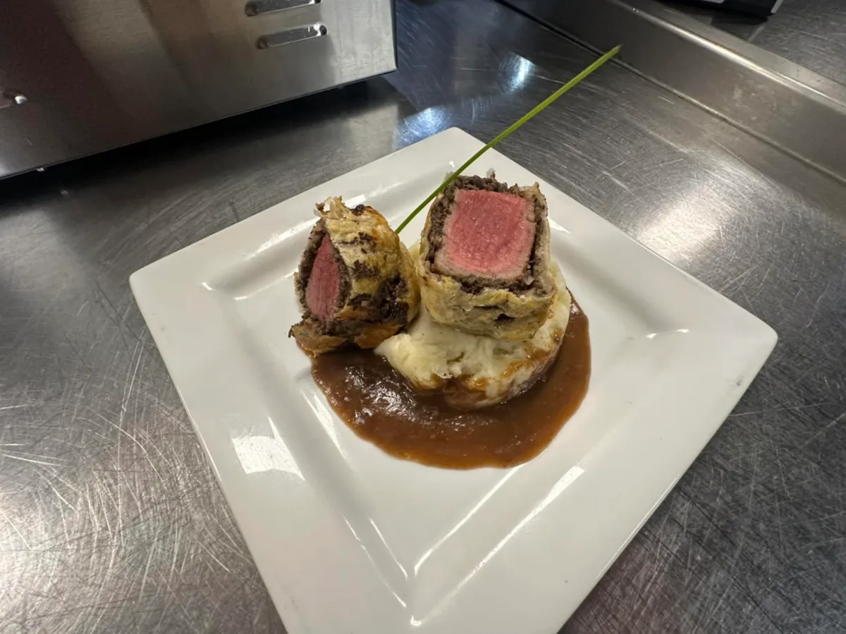 Beef Wellington over mashed potatoes